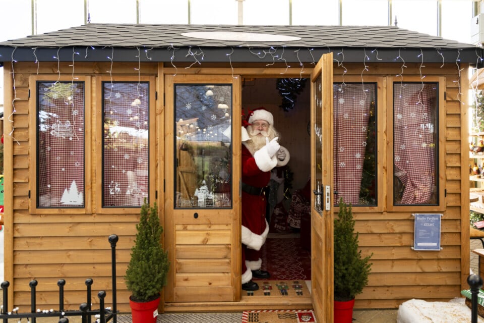 Santa at door to Studio Pavilion being used as a Santa's Grotto.