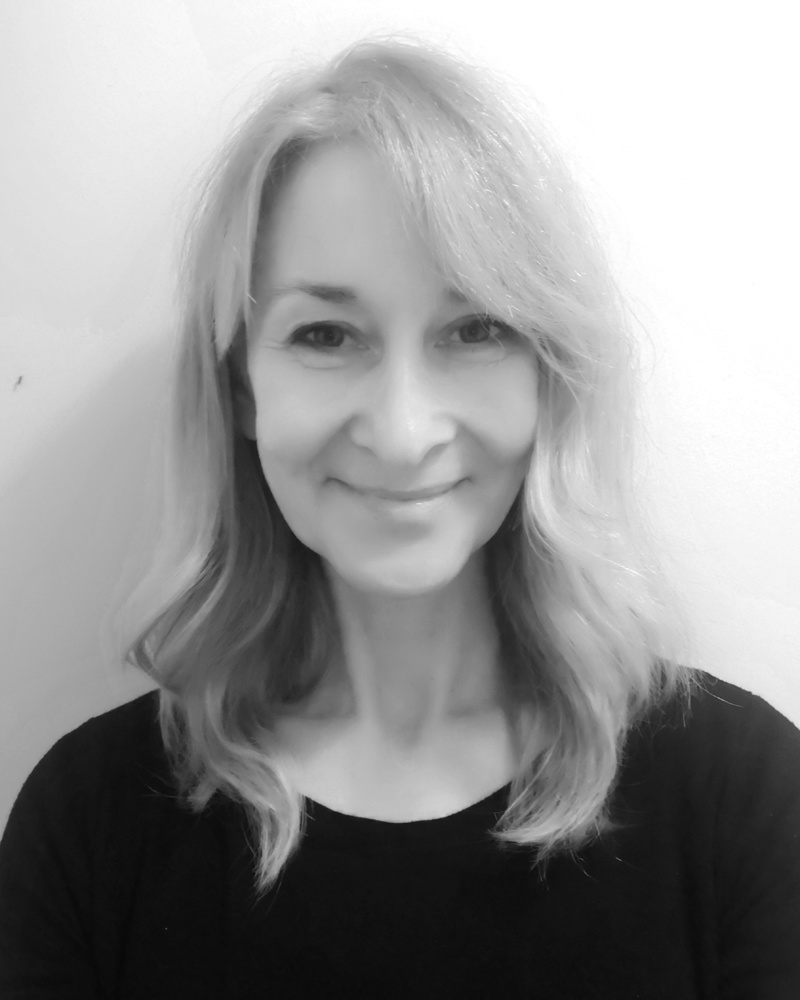 A black and white headshot of Cathy who is smiling. Cathy works as part of our sales team at our Cheltenham showsite