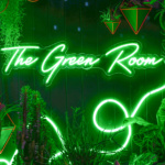 green neon LED light reads 'The Green Room'