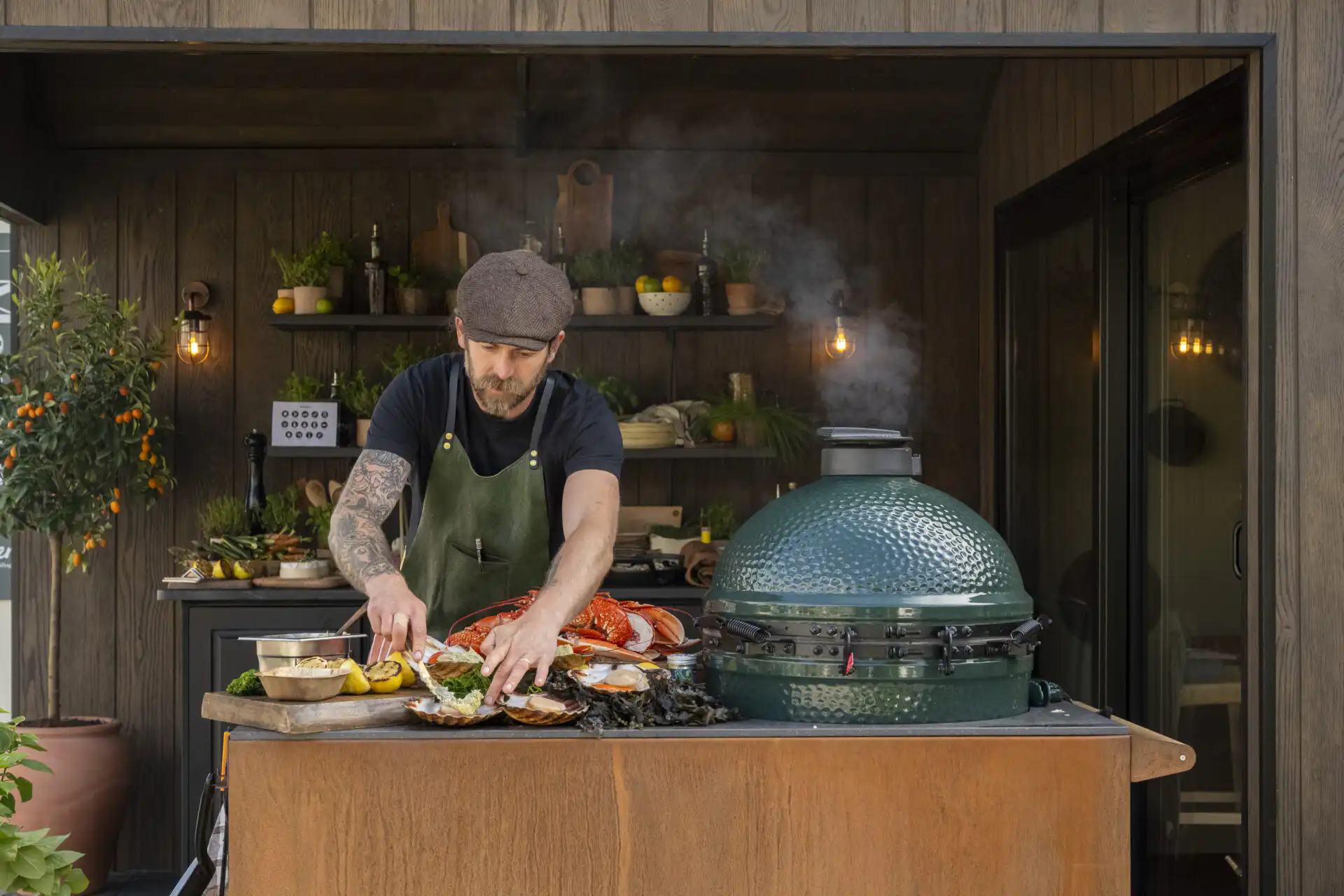 Chef James Strawbridge cooking on the Malvern Garden Buildings tradestand at Chelsea Flower Show 2026