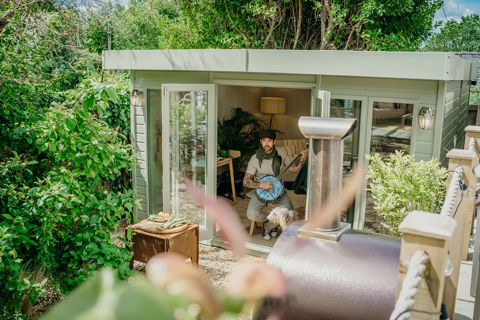 Chef James Strawbridge playing the banjo in his Studio Flat by Malvern Garden Buildings