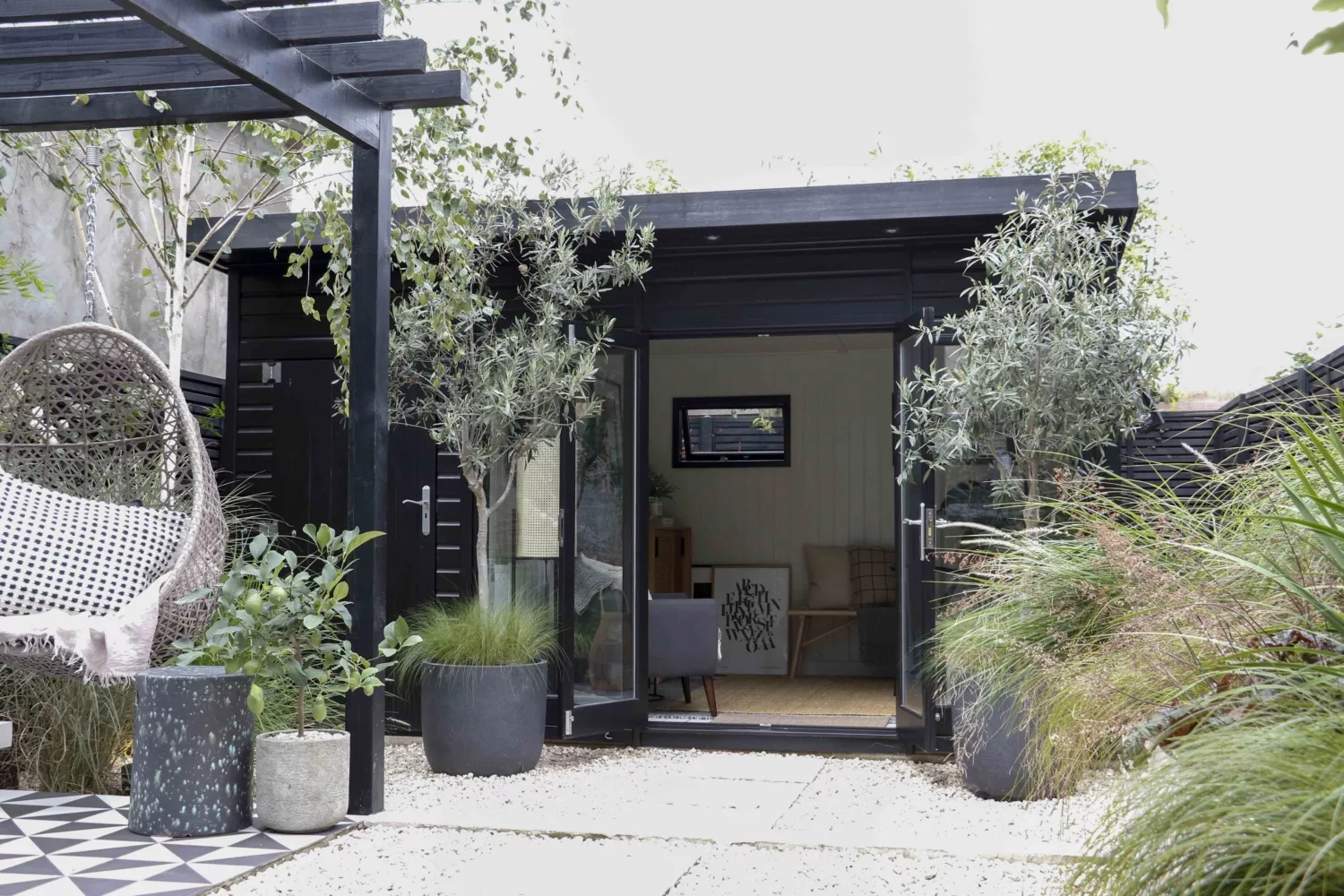 Justin Coakley's (Design at Nineteen) Garden Studio all styled up for Christmas in his signature monochrome interior style. Garden Escape by Malvern Garden Buildings