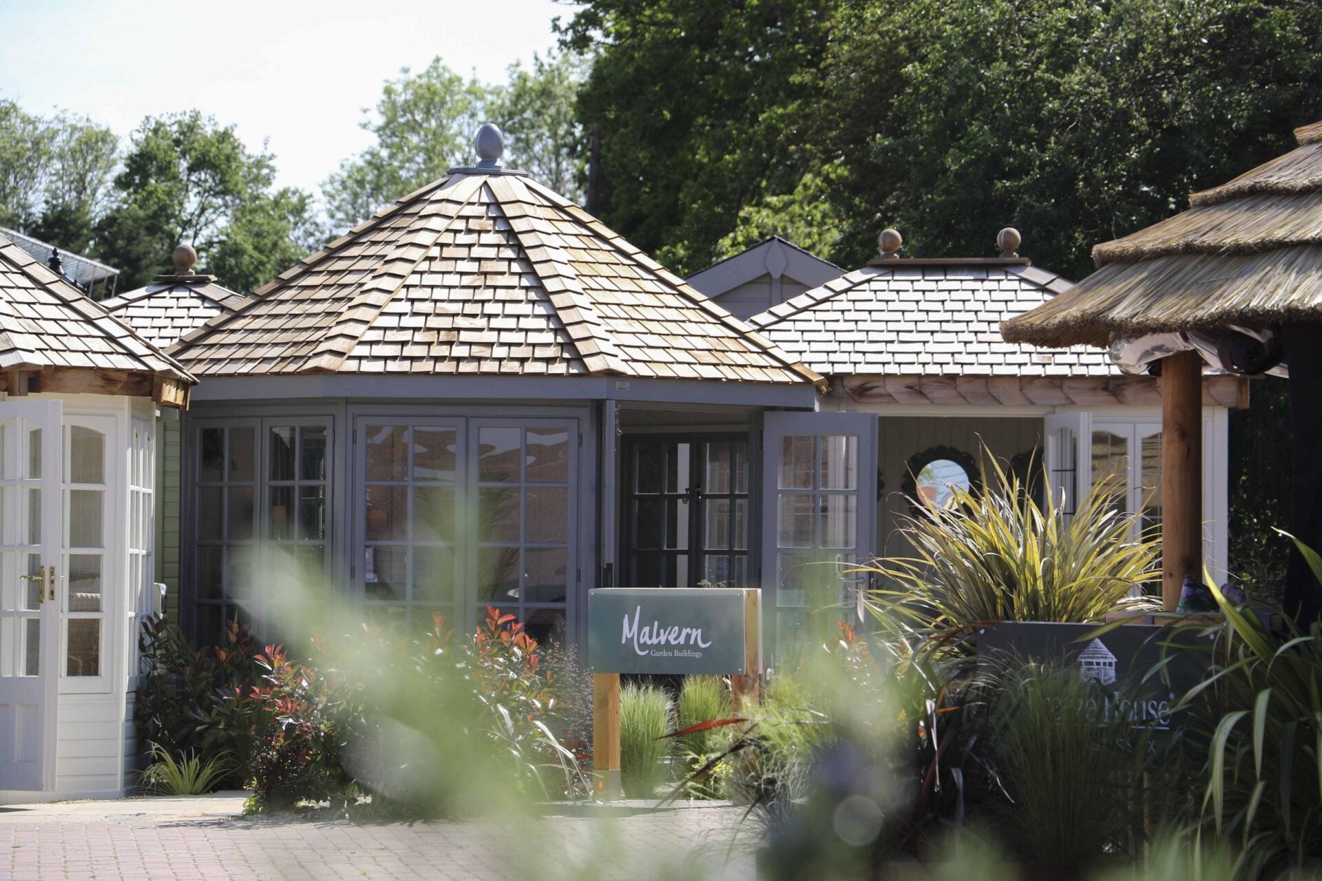 A few of the buildings on display at one of Malvern Garden Buildings' 12 UK showsites