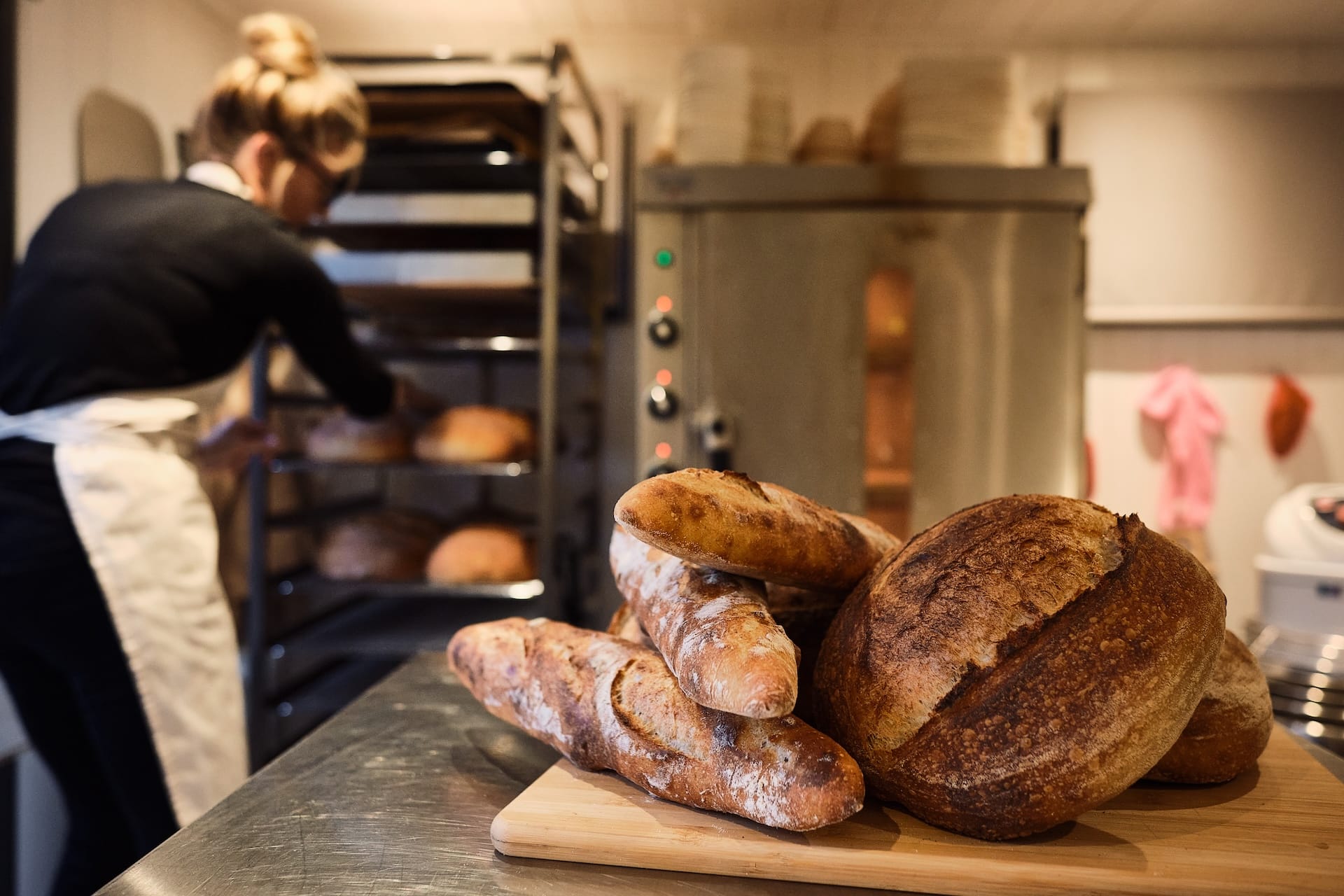 bread and more loaves stacked on table