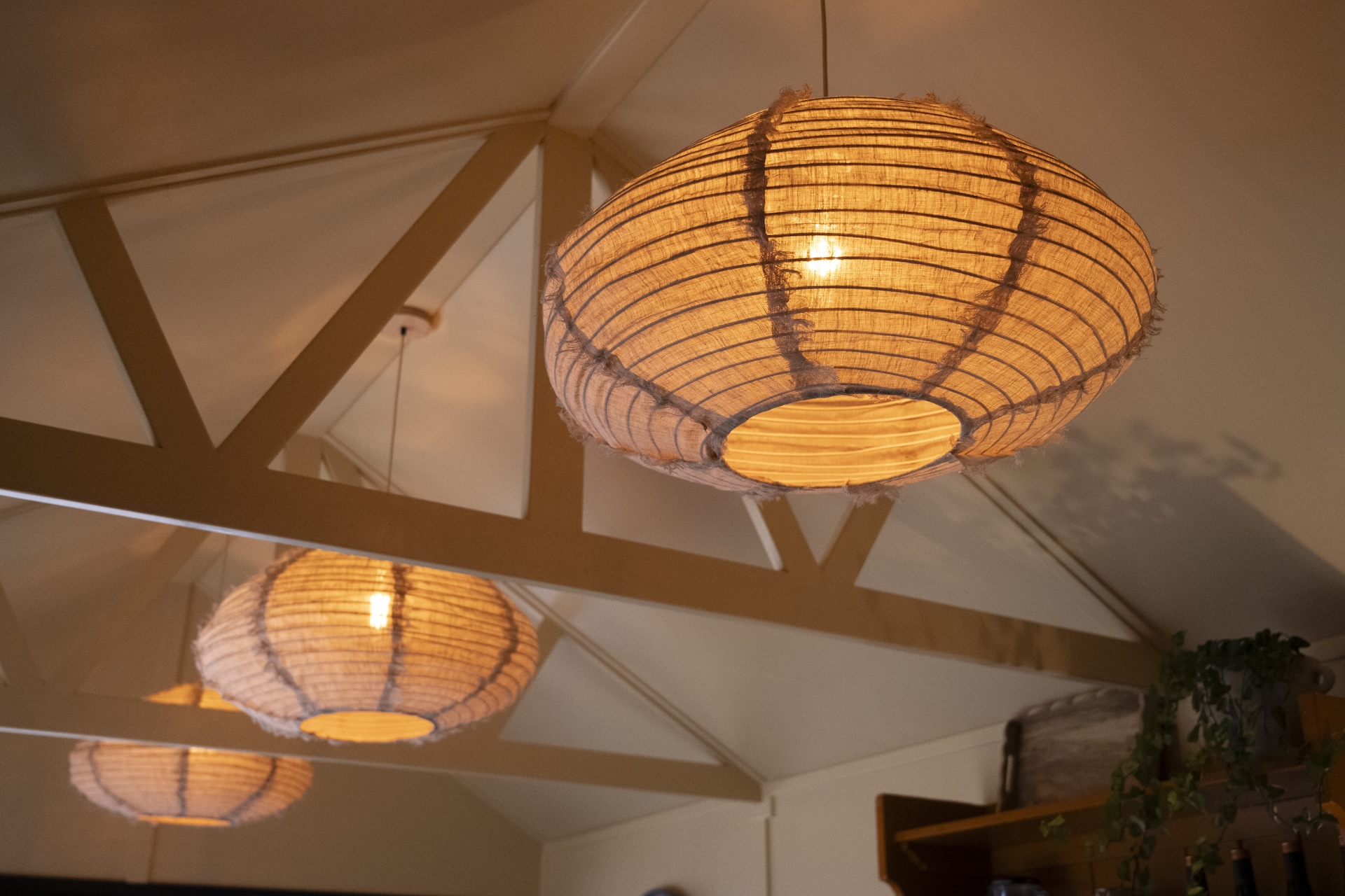pendant lights inside L Shaped building on mgb tradestand at RHS Chselsea