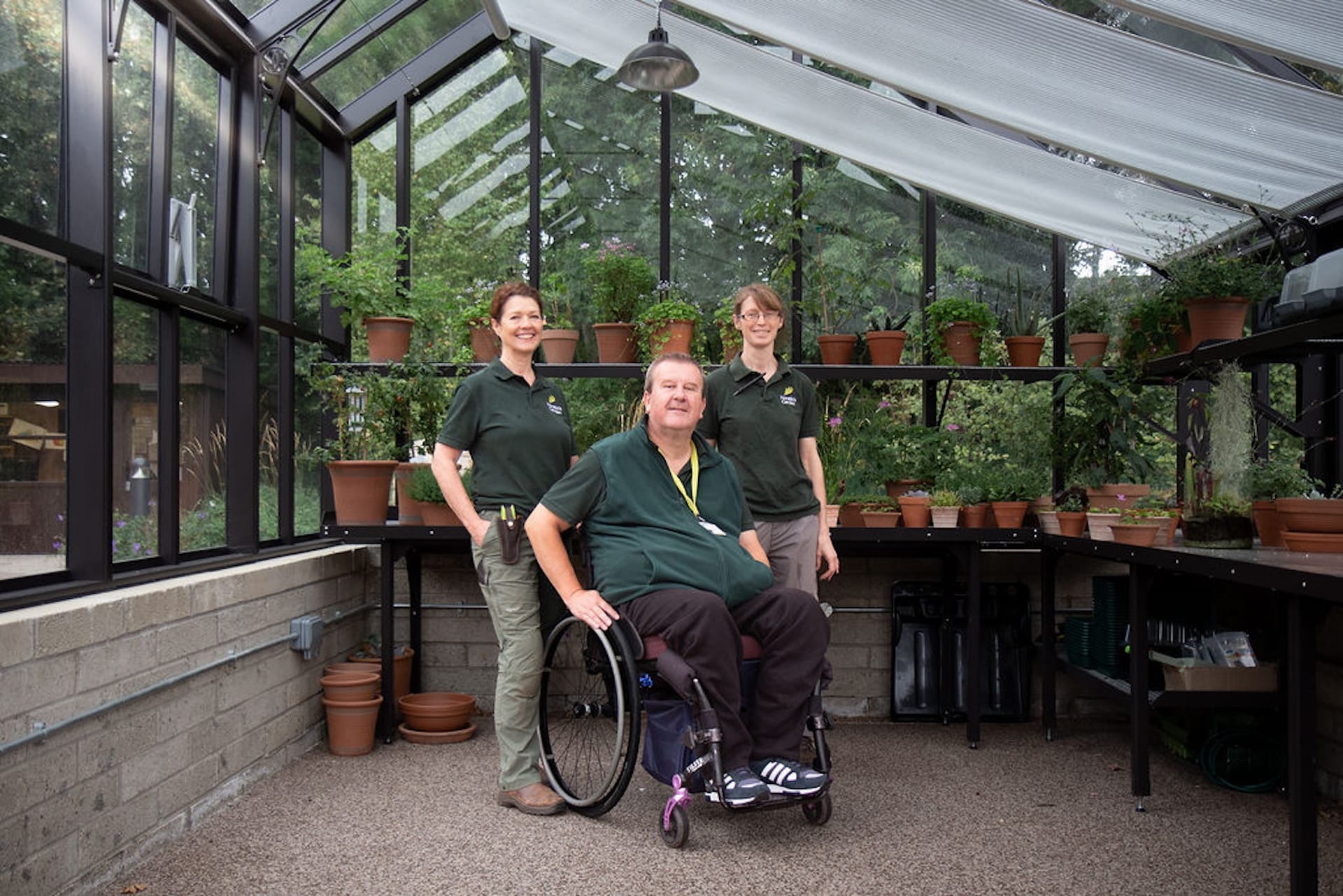 ruth calder head gardener with volunteers inside horatios garden