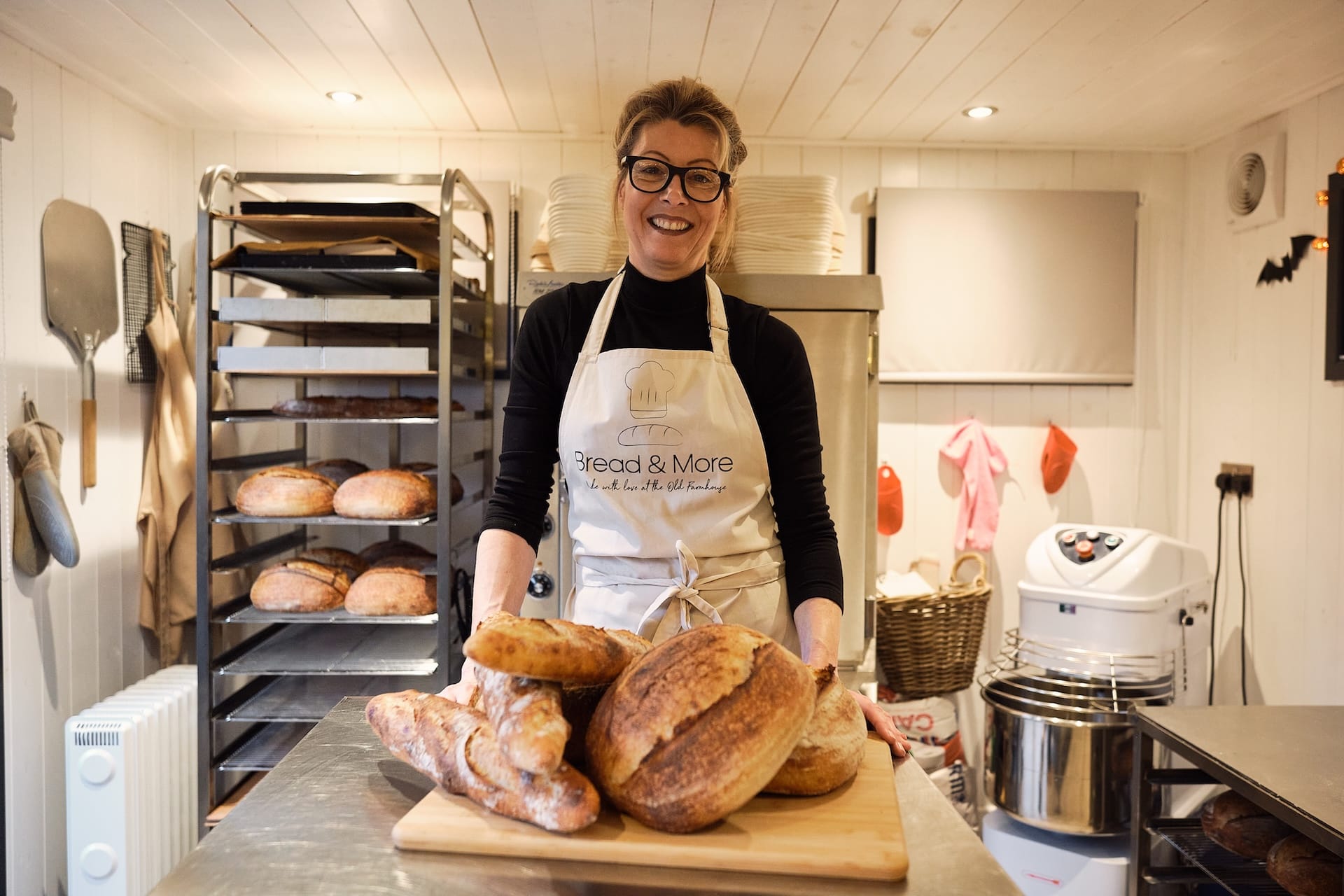 vanessa from bread and more with loaves of bread on table