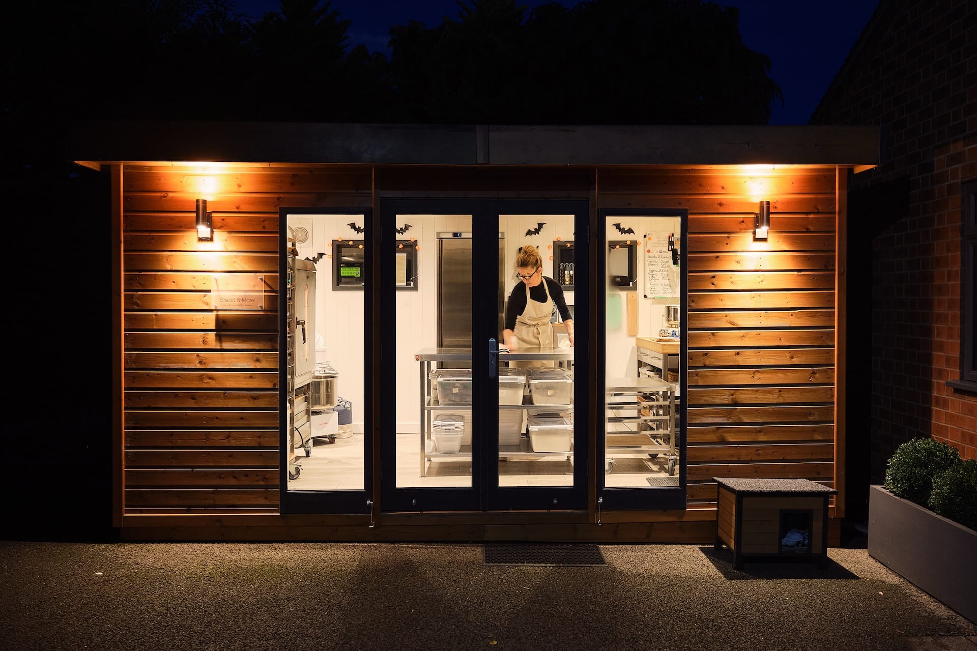 vanessa from bread and more working inside malvern studio flat at night